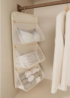 Hængende garderobeorganizer med netlommer lynlås foldbart pladsbesparende design | Ninon